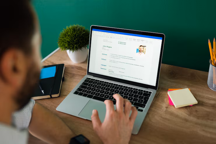 rear view adult man searching new job working writing his resume laptop 662251 2153
